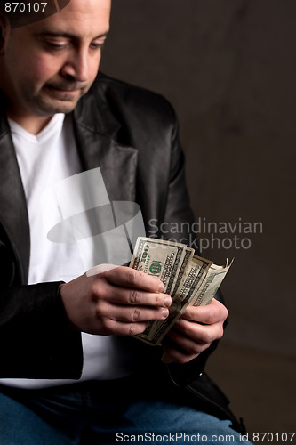 Image of Man Counting Cash