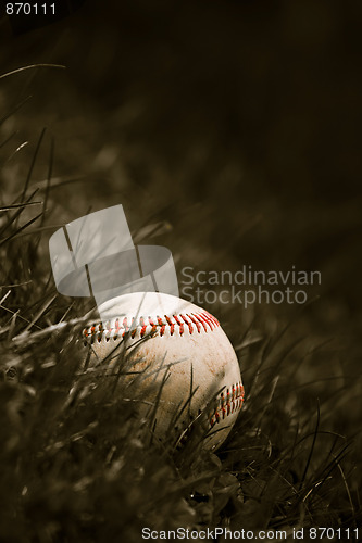 Image of Old Baseball in the Grass