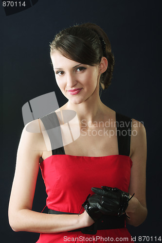 Image of Brunette in red dress and gloves