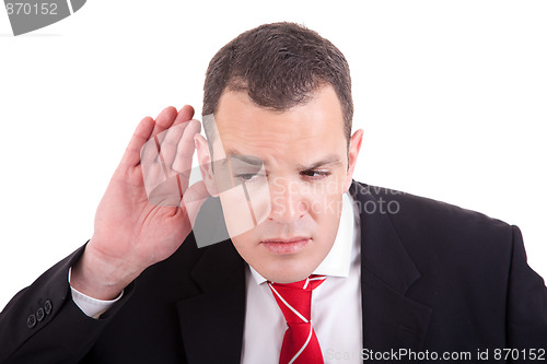 Image of businessman, listening, viewing the  gesture of hand behind the ear, isolated on white background