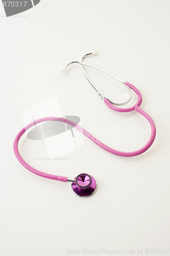 Image of pink stethoscope on white