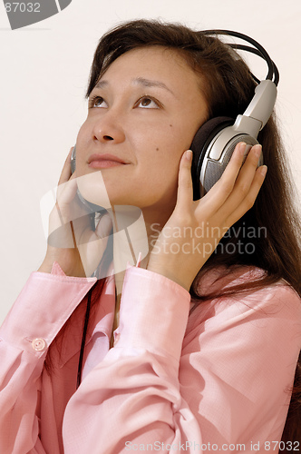 Image of Girl in a red shirt with headphones