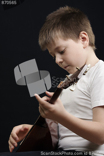 Image of Kid playing balalaika