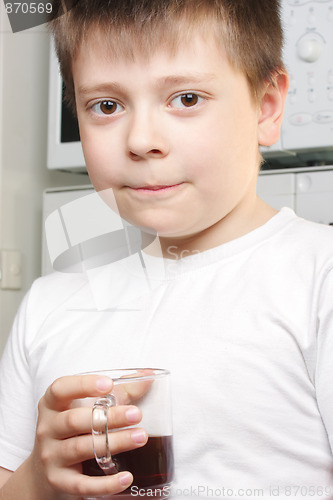 Image of Kid in white with tea