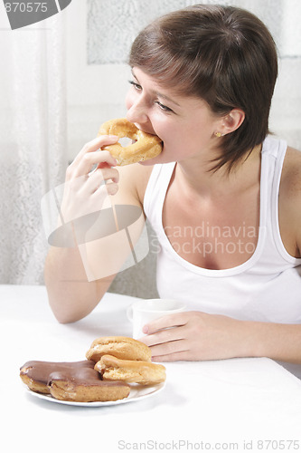 Image of Woman biting cake