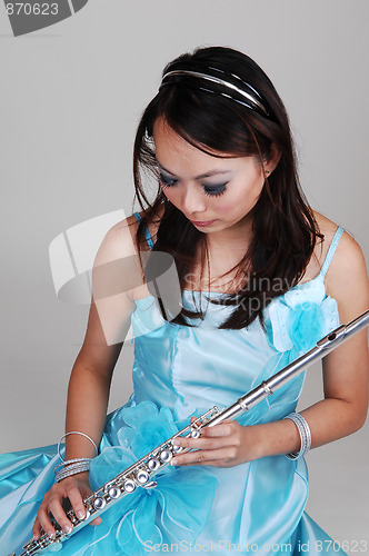 Image of Chinese girl in dress with flute.