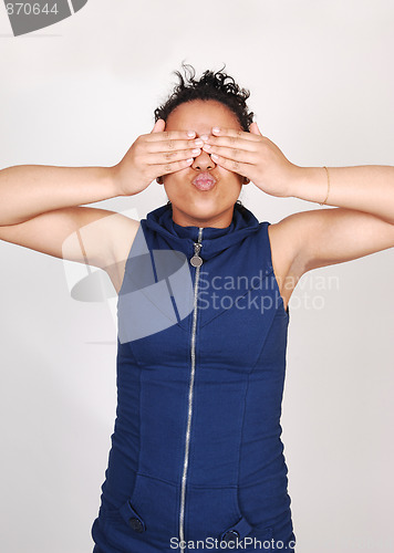 Image of Young woman covering her eyes.