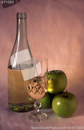 Image of White wine and apples on painted background
