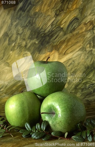 Image of Three green apples on painted background