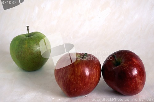 Image of Three apples on painted background