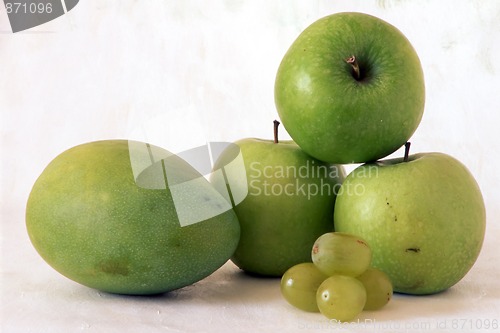 Image of Green apple and mango on painted background