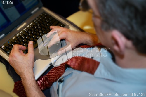 Image of Businessman working with laptop computer