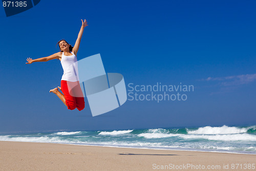 Image of Young woman jumping