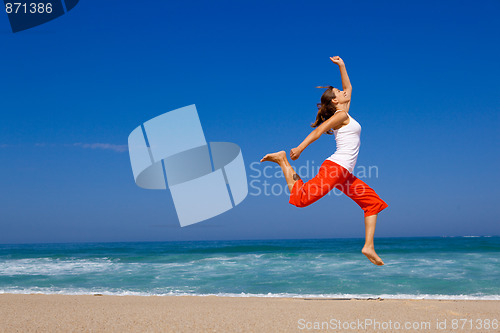 Image of Young woman jumping