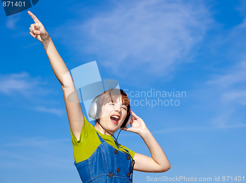 Image of Happy woman listen music