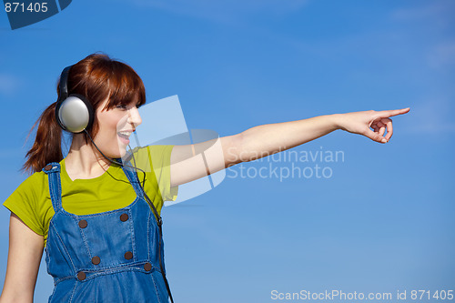 Image of Happy woman listen music