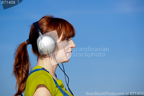 Image of Happy woman listen music