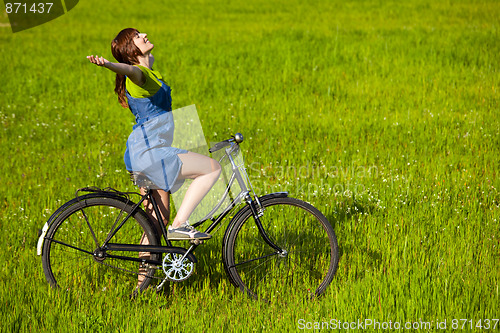 Image of Girl with a bicycle