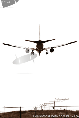 Image of An airplane landing, B&W sepia