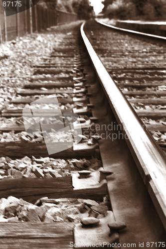 Image of Rail road tracks. Black and white sepia. Close-up