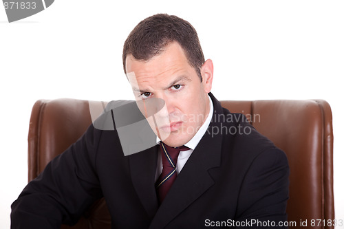 Image of Businessman upset seated on a chair