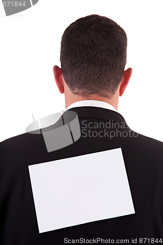 Image of back of businessman, with a paper