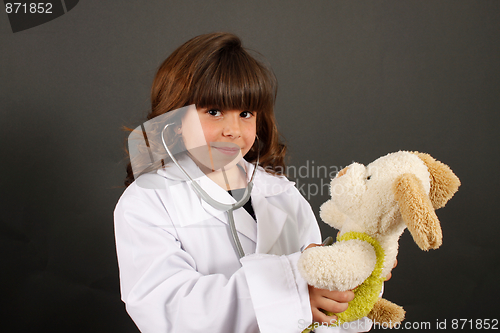 Image of Little girl with stuffed dog
