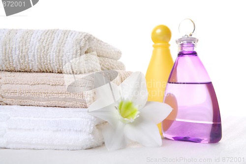 Image of shampoo, towels and aromatic oil, 