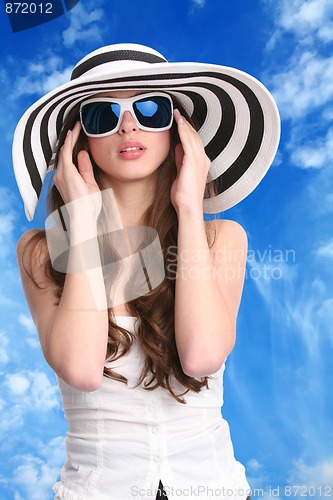 Image of pretty woman in striped hat