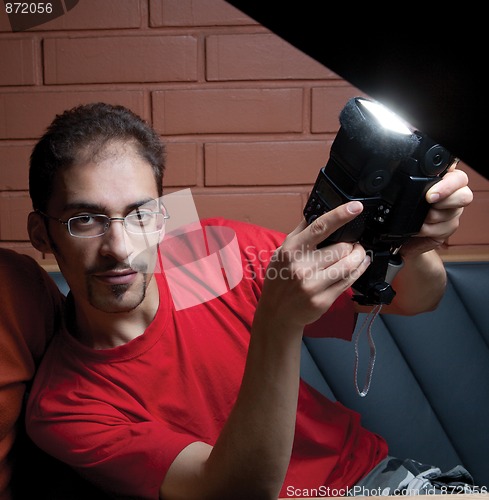 Image of young man in a red T-shirt