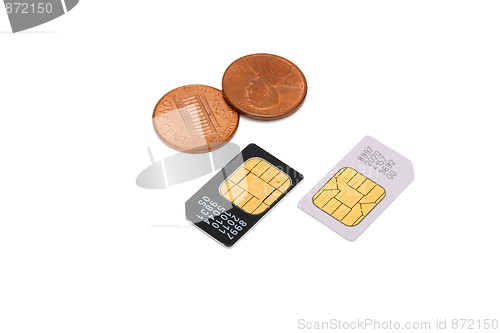 Image of Two SIM cards for cellular phones and Americal cents isolated 