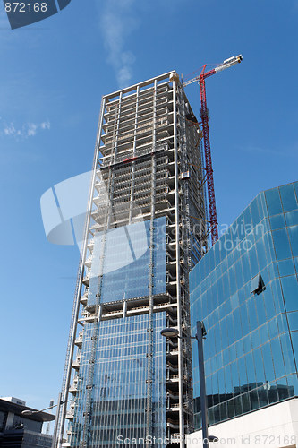 Image of Lifting crane at skyscraper construction site