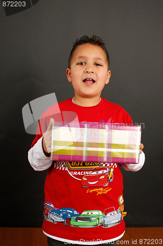 Image of Boy holding a gift 