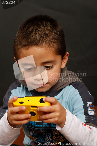 Image of A boy with a disposable camera