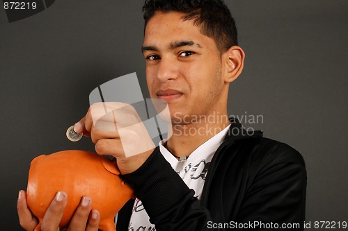 Image of Man and is piggy bank