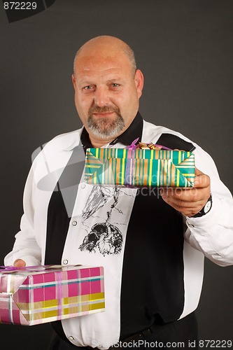 Image of Man giving a wrapped present