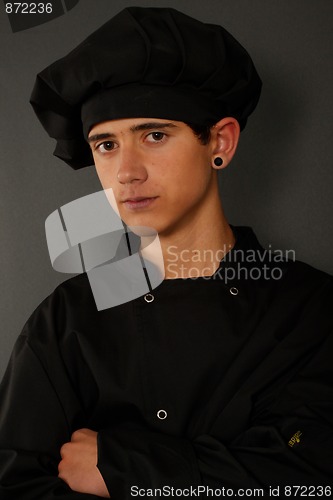 Image of Young spanish cook with a black earring