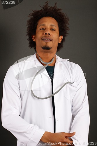 Image of Doctor standing isolated over a black background
