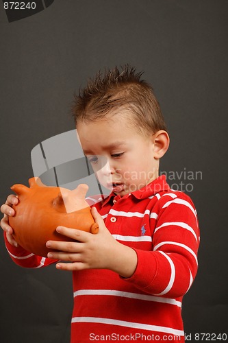 Image of Child and is piggy bank