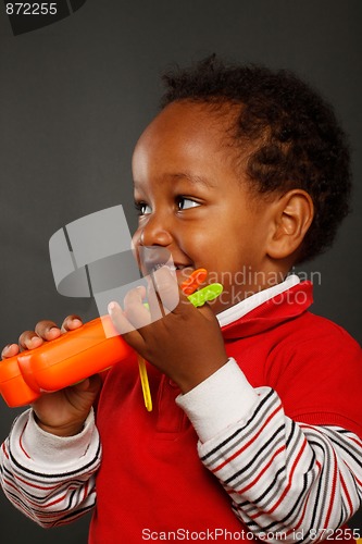 Image of A cute kid play with plastic keys