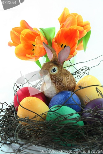 Image of Easter basket with eggs and Easter bunny and tulip