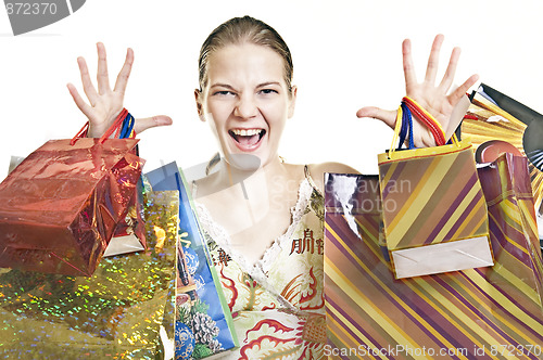 Image of exalted woman with shopping bags