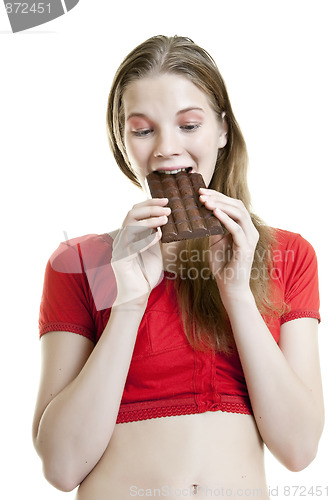 Image of young woman enjoying chocolate bar 