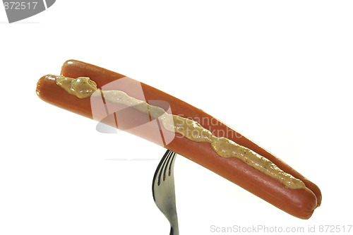 Image of Wiener Wüstchen with mustard on a fork