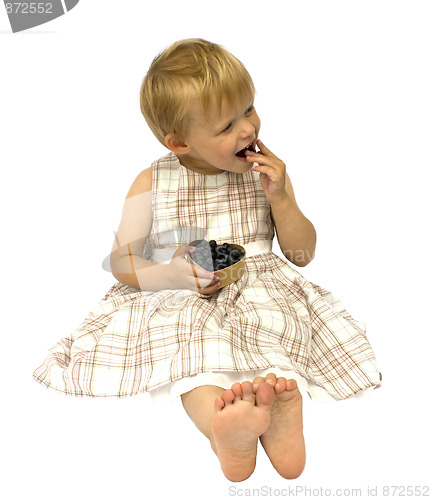 Image of Child eating blueberries