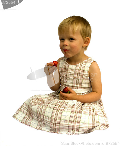 Image of Child eating strawberries