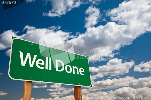 Image of Well Done Green Road Sign with Sky