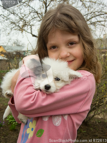 Image of girl and puppy