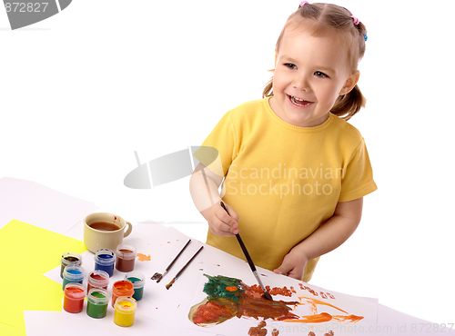 Image of Cute child play with paints