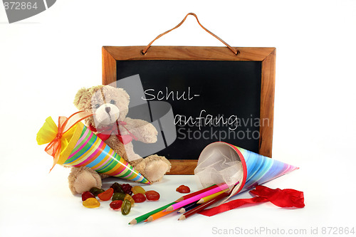 Image of School board with Teddy and school cone